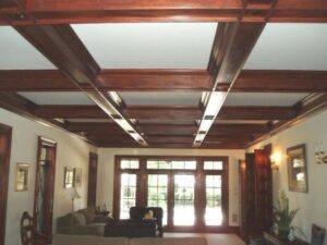 Coffered ceiling with custom wood beams milled on a Williams & Hussey molder