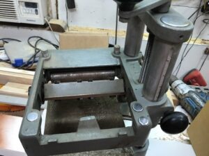 Williams & Hussey molder with original steel feed rollers in use at JFK Construction